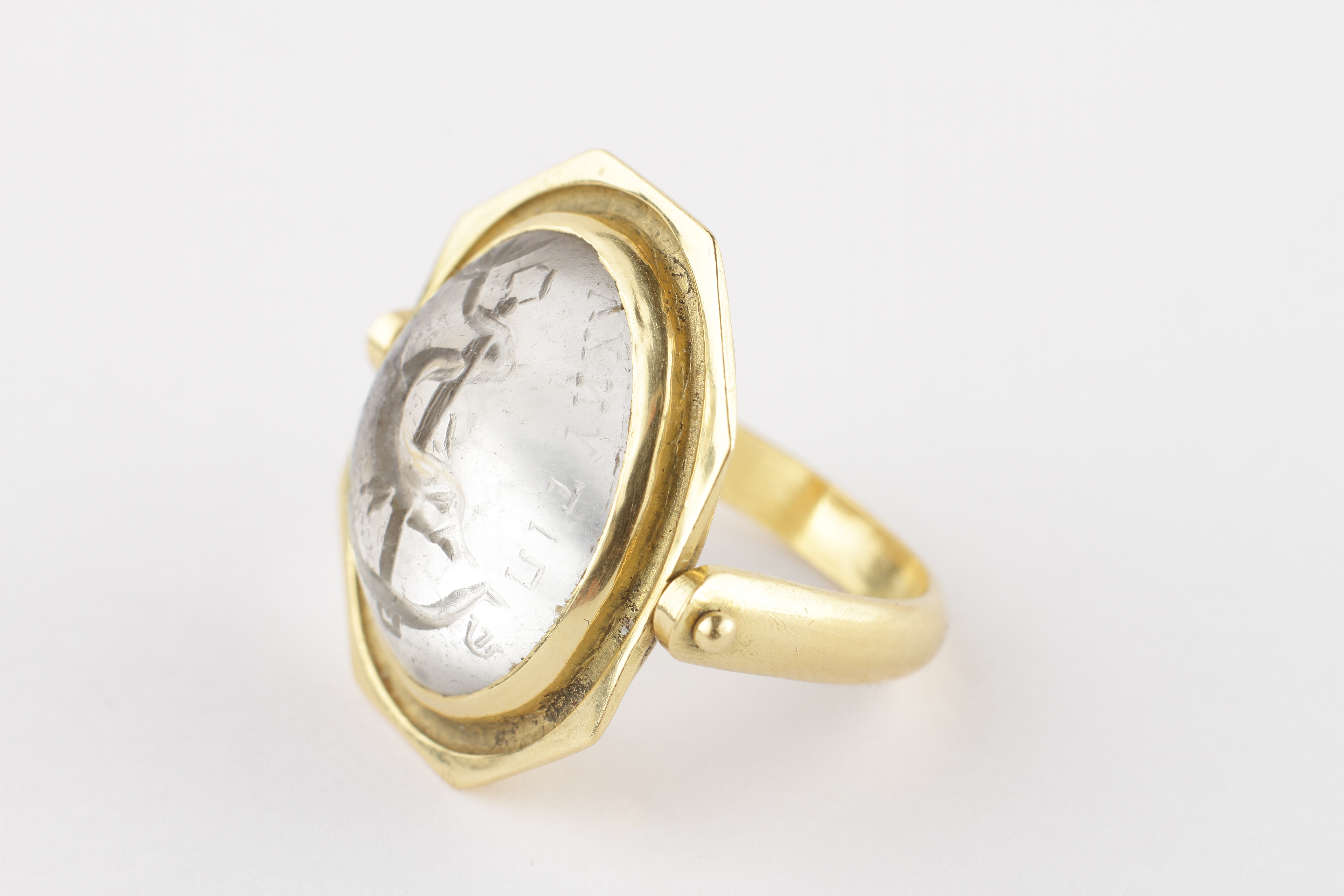 An Early Christian Rock Crystal Intaglio set in a Gold Swivel Ring